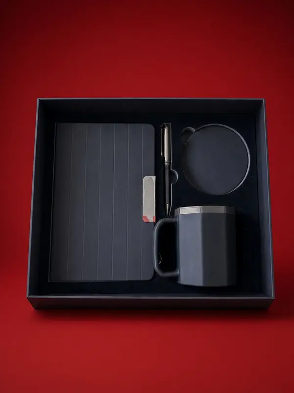 Libreta, taza octagonal, porta vasos y bolígrafo